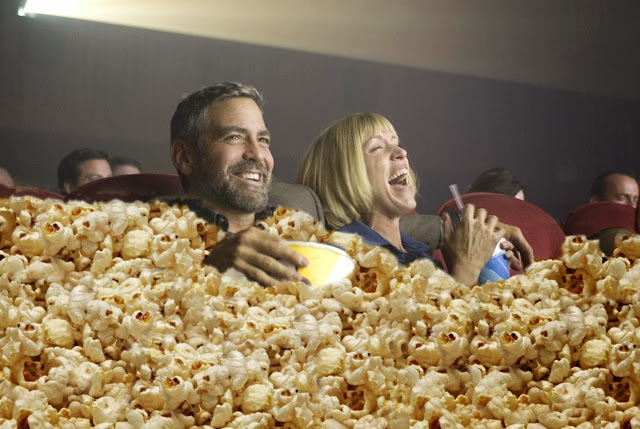 george-clooney-eating-popcorn-at-movies-64616.jpg